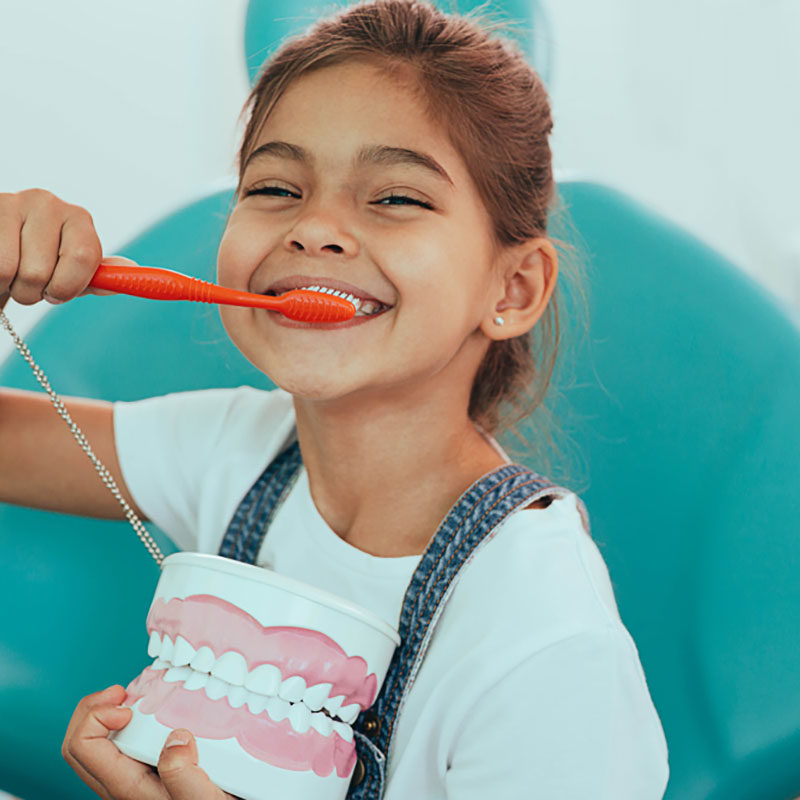 young-kid-caring-for-her-dental-health