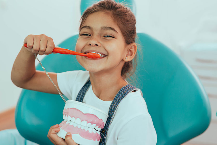 young-kid-caring-for-her-dental-health