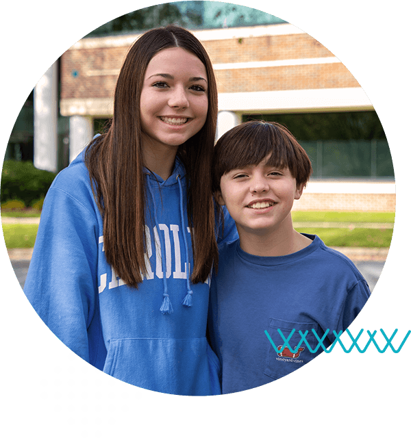 teens-smiling-in-blue-shirts