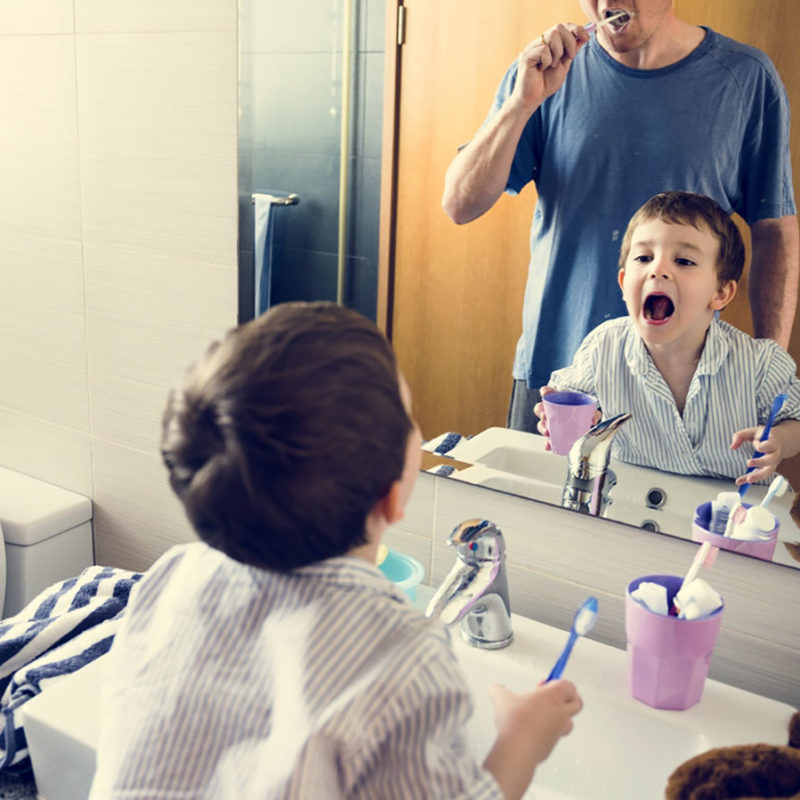 kid-and-parent-caring-for-oral-hygiene