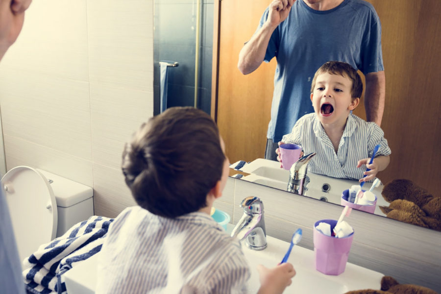 kid-and-parent-caring-for-oral-hygiene
