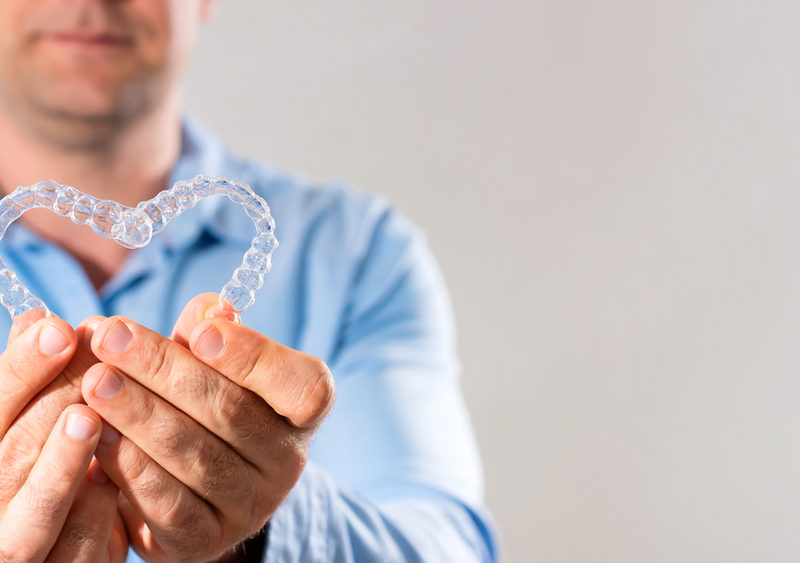 VanderWall holding invisalign retainers